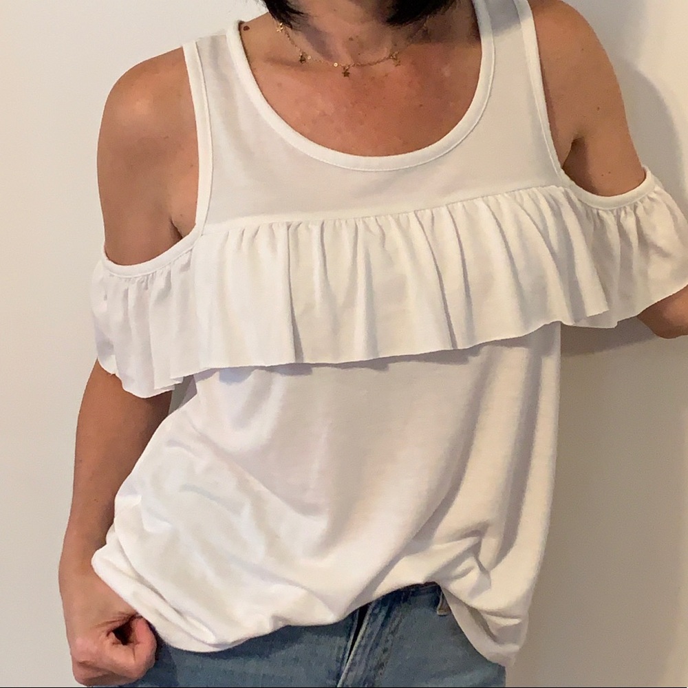 White open shoulder top with ruffle detail.